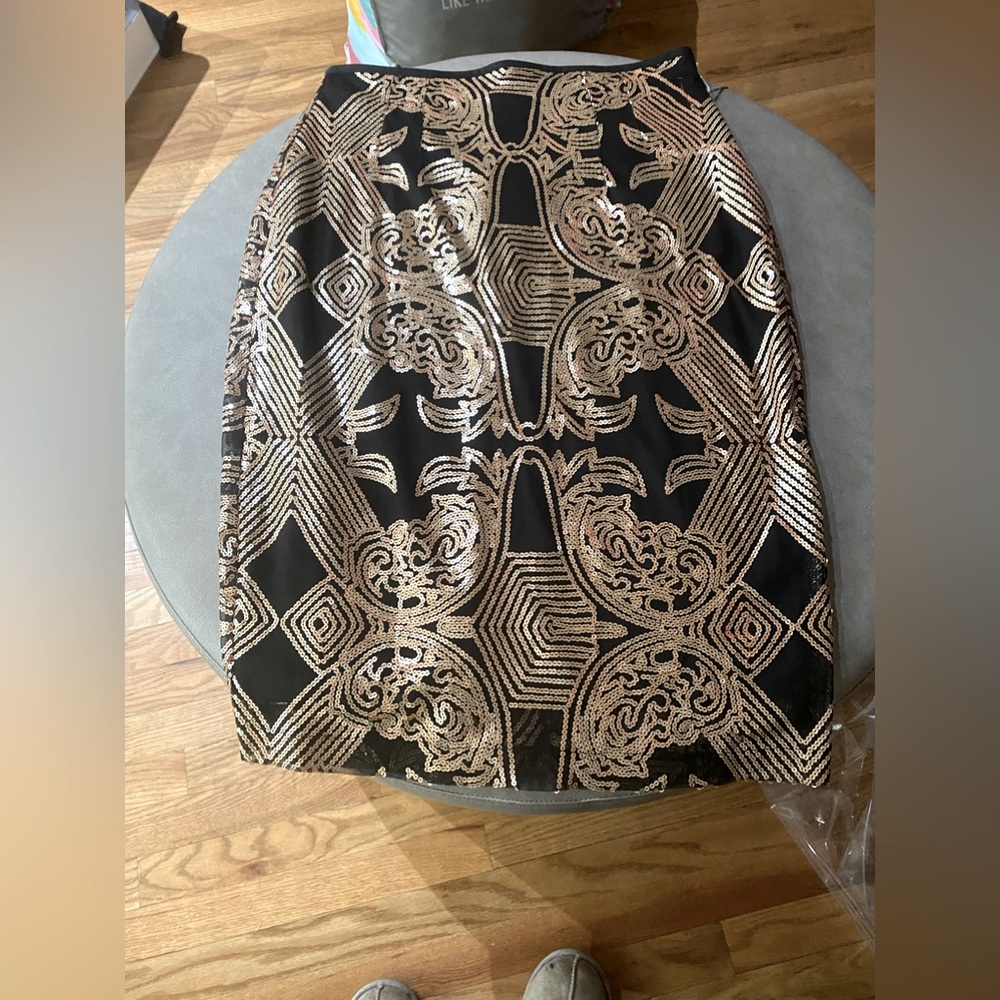 This is a black and gold sequins skirt with tags from NY&C Size 8.